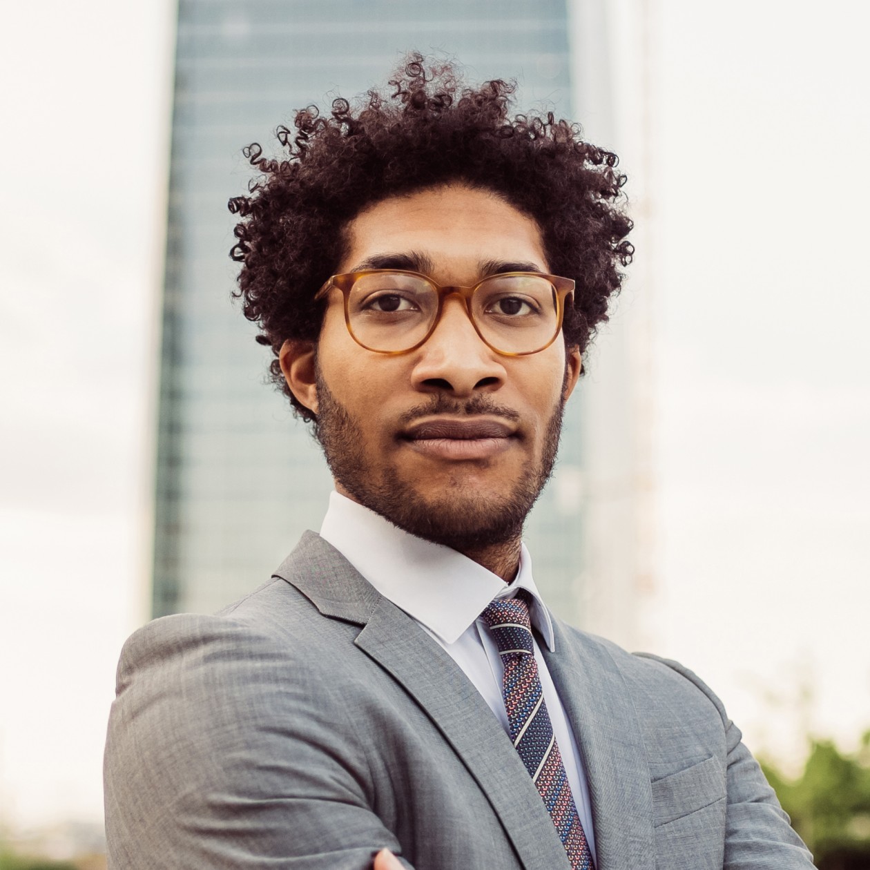Testimonials Portrait Of Businessman Wearing Glasses And Grey S BKAMNTD 1 1